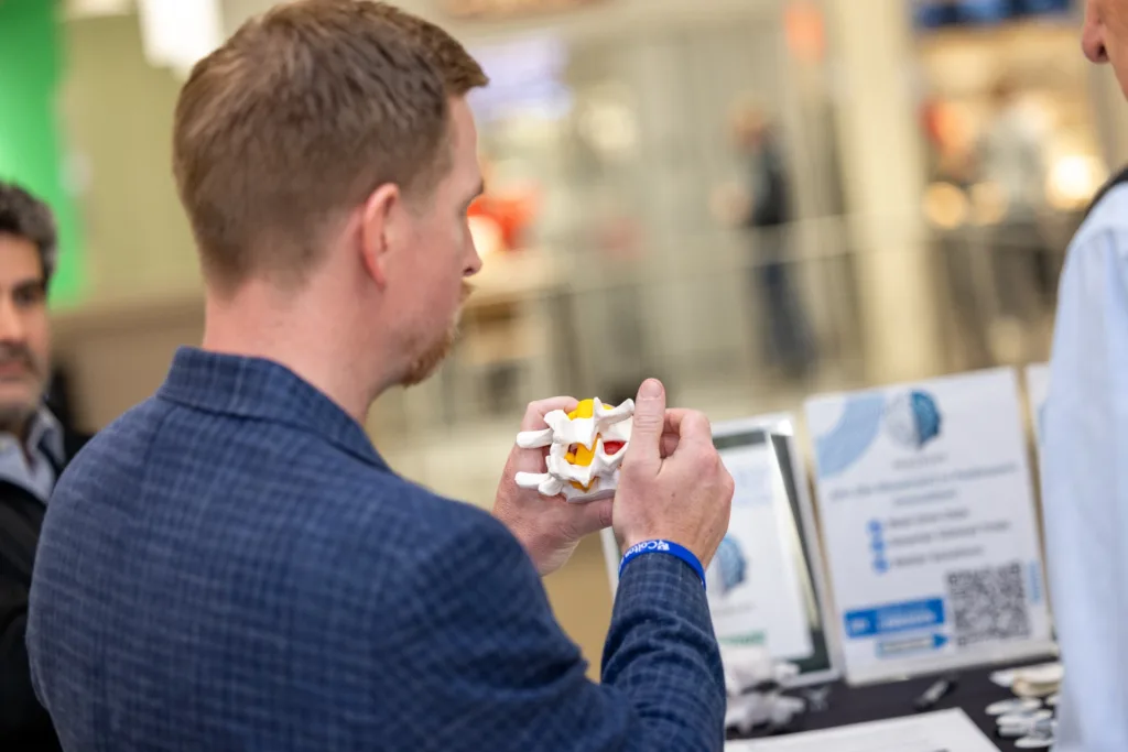 Dan Newman holding prototype